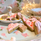 "Handmade allergy-friendly vegan dog cookies in heart-shaped designs from the Cordially Yours gift set."